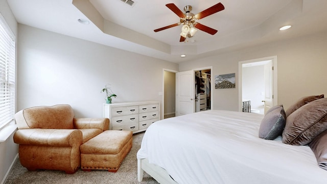 5127 Heroes Ln, Murfreesboro, TN 37129 - carpeted bedroom featuring multiple windows, recessed lighting, baseboards, a tray ceiling, and a walk in closet