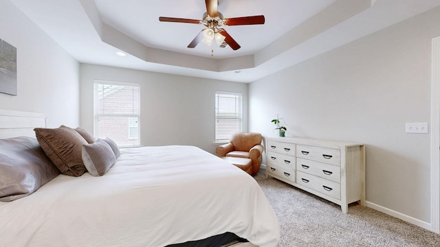 5127 Heroes Ln, Murfreesboro, TN 37129 - bedroom featuring light colored carpet, a tray ceiling, baseboards, and a ceiling fan