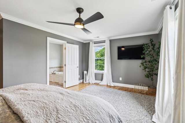 303 Avondale Dr, Franklin, TN 37064 - bedroom featuring crown molding, baseboards, wood finished floors, ensuite bath, and ceiling fan