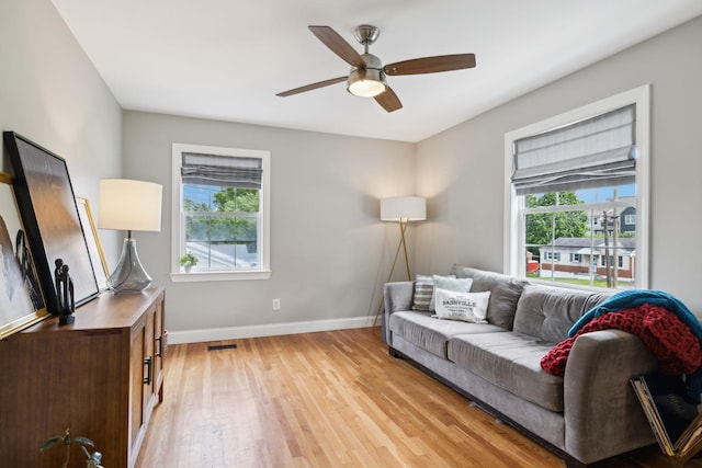 303 Avondale Dr, Franklin, TN 37064 - living area featuring healthy amount of natural light, light wood finished floors, ceiling fan, and baseboards