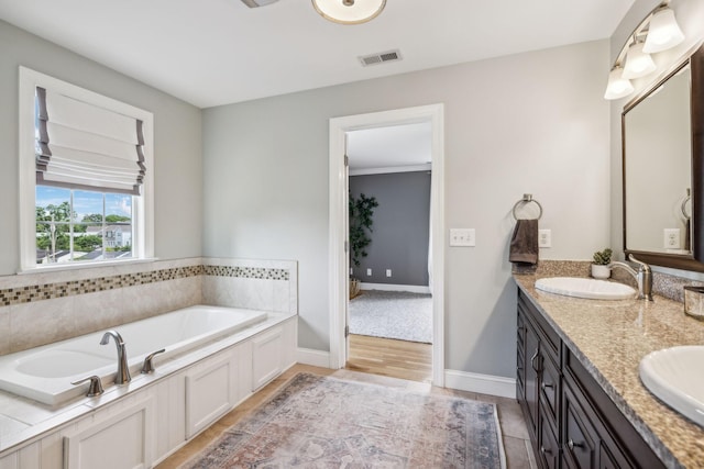 303 Avondale Dr, Franklin, TN 37064 - full bathroom with double vanity, a garden tub, and baseboards