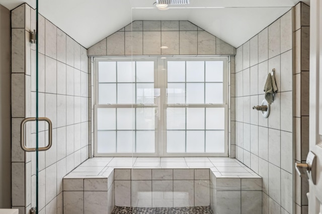 303 Avondale Dr, Franklin, TN 37064 - bathroom featuring vaulted ceiling, a stall shower, and tile walls