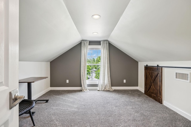 303 Avondale Dr, Franklin, TN 37064 - bonus room featuring carpet floors, baseboards, vaulted ceiling, and a barn door