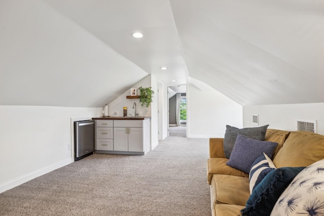 303 Avondale Dr, Franklin, TN 37064 - living room with light carpet, lofted ceiling, and baseboards