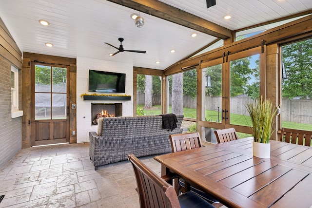 303 Avondale Dr, Franklin, TN 37064 - sunroom with a large fireplace, ceiling fan, and healthy amount of natural light