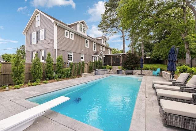 303 Avondale Dr, Franklin, TN 37064 - view of pool with a sunroom, a patio, a fenced backyard, and a diving board