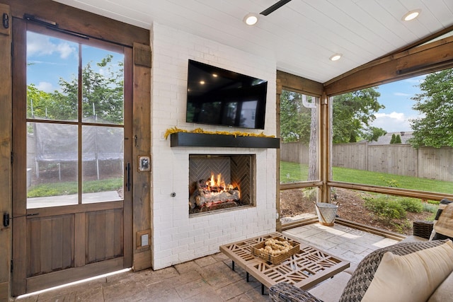 303 Avondale Dr, Franklin, TN 37064 - sunroom featuring an outdoor brick fireplace and vaulted ceiling