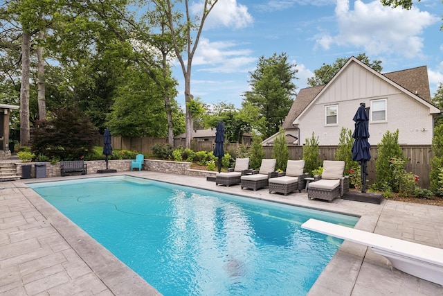 303 Avondale Dr, Franklin, TN 37064 - view of swimming pool featuring a patio, a diving board, and a fenced backyard