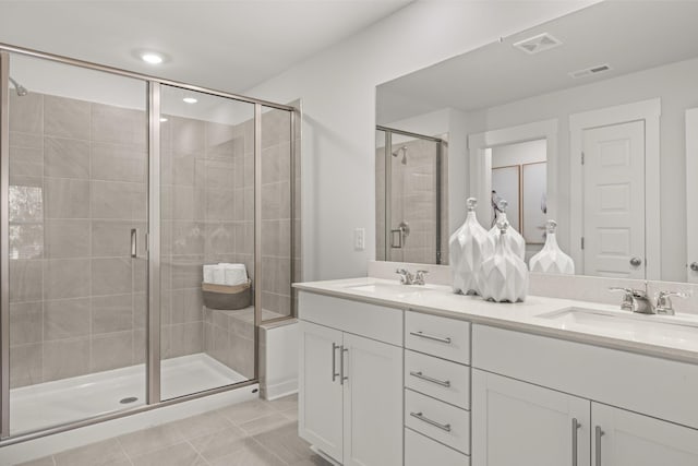 7218 Hanworth St, Fairview, TN 37062 - full bathroom with double vanity, a stall shower, and tile patterned floors