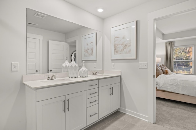 7218 Hanworth St, Fairview, TN 37062 - ensuite bathroom featuring double vanity, baseboards, tile patterned floors, and recessed lighting