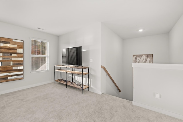 7218 Hanworth St, Fairview, TN 37062 - living area with an upstairs landing, carpet floors, and baseboards