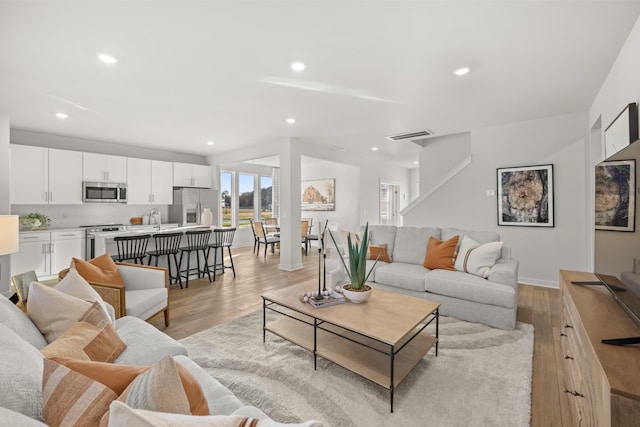 7218 Hanworth St, Fairview, TN 37062 - living area with light wood-type flooring, recessed lighting, and baseboards