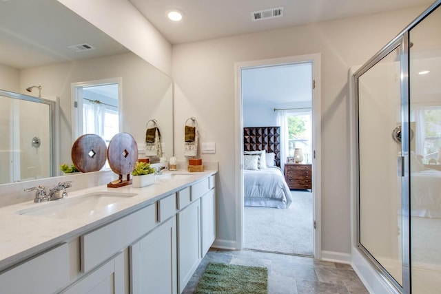 517 Ferndale Pl, Lebanon, TN 37087 - ensuite bathroom featuring a stall shower, double vanity, healthy amount of natural light, and baseboards
