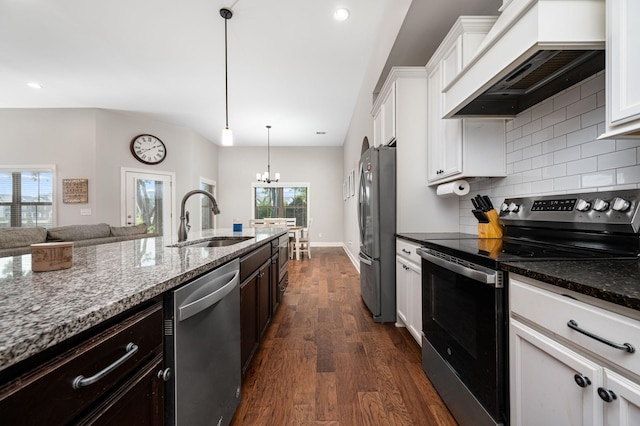 2743 Crowne Pointe Dr, Murfreesboro, TN 37130 - kitchen featuring stainless steel appliances, custom exhaust hood, a sink, dark wood-style flooring, and a chandelier