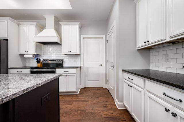2743 Crowne Pointe Dr, Murfreesboro, TN 37130 - kitchen with electric stove, custom range hood, backsplash, white cabinets, and dark wood-style floors