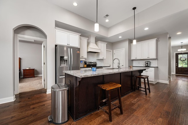 2743 Crowne Pointe Dr, Murfreesboro, TN 37130 - kitchen featuring stainless steel appliances, custom range hood, a sink, dark wood-type flooring, and tasteful backsplash