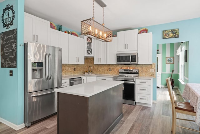 1514 Cardinal Ln, Mount Juliet, TN 37122 - kitchen with stainless steel appliances, light wood-type flooring, light countertops, and white cabinetry