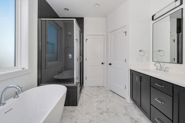 107 E 9th St Unit D7, Columbia, TN 38401 - bathroom featuring marble look tile flooring, vanity, a freestanding bath, a stall shower, and recessed lighting