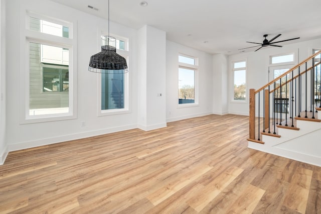 107 E 9th St Unit D7, Columbia, TN 38401 - unfurnished living room with light wood finished floors, healthy amount of natural light, and baseboards