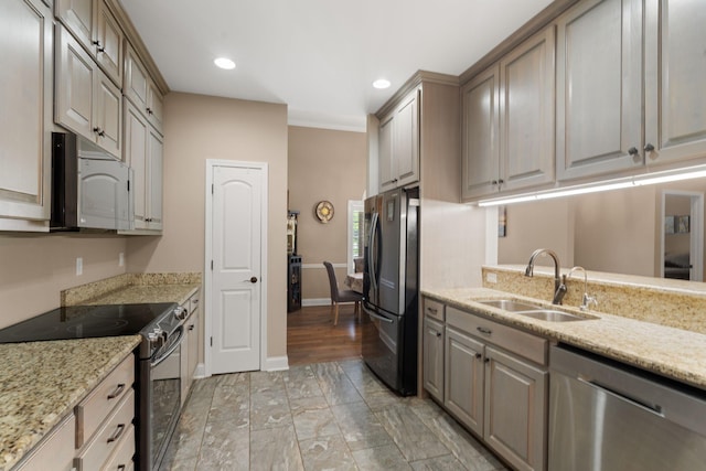 3006 Gracie Ann Dr, Greenbrier, TN 37073 - kitchen with appliances with stainless steel finishes, a sink, recessed lighting, baseboards, and light stone counters