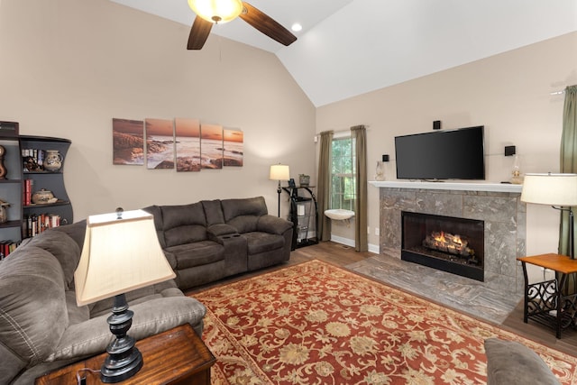 3006 Gracie Ann Dr, Greenbrier, TN 37073 - living area with wood finished floors, ceiling fan, a high end fireplace, high vaulted ceiling, and baseboards