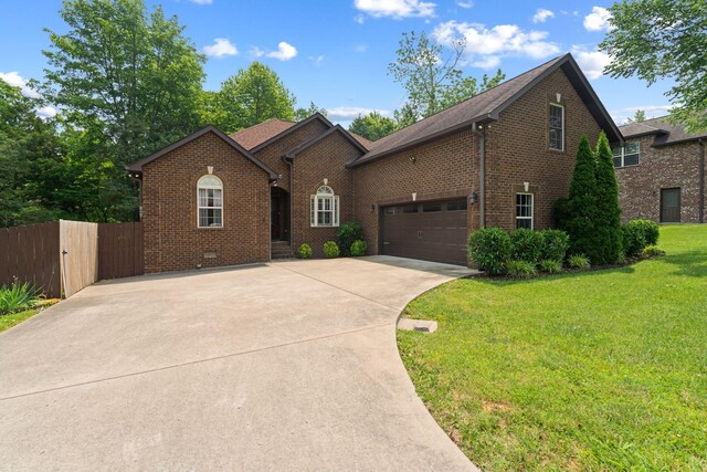 3006 Gracie Ann Dr, Greenbrier, TN 37073 - view of front of house with brick siding, driveway, and a garage