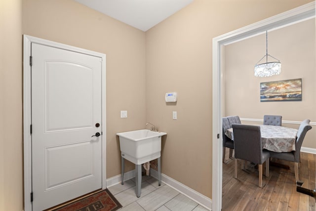 3006 Gracie Ann Dr, Greenbrier, TN 37073 - foyer entrance featuring baseboards, a chandelier, and light wood-style floors