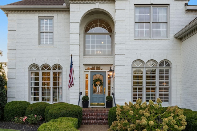 403 Butterfly Ct, Franklin, TN 37069 - view of exterior entry featuring brick siding and a shingled roof