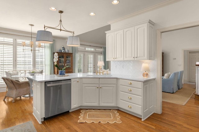 403 Butterfly Ct, Franklin, TN 37069 - kitchen featuring stainless steel dishwasher, a sink, recessed lighting, light countertops, and light wood-style flooring