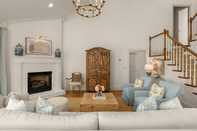 403 Butterfly Ct, Franklin, TN 37069 - living area with a chandelier, stairs, wood finished floors, a high ceiling, and baseboards