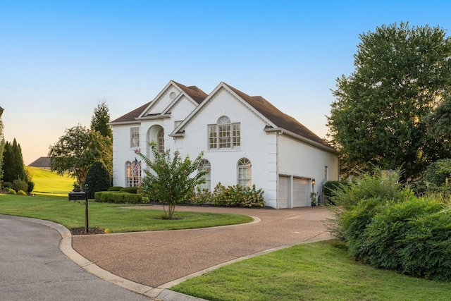 403 Butterfly Ct, Franklin, TN 37069 - view of front of house featuring a lawn, concrete driveway, an attached garage, and brick siding