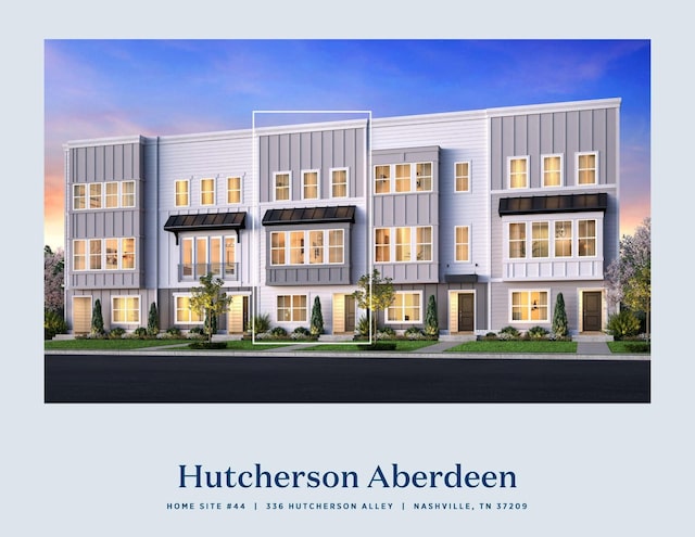 336 Hutcherson Aly, Nashville, TN 37209 - back of property at dusk featuring a standing seam roof, board and batten siding, and metal roof