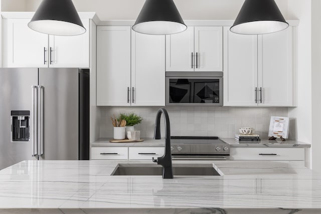 336 Hutcherson Aly, Nashville, TN 37209 - kitchen with high end fridge, a sink, light stone counters, tasteful backsplash, and pendant lighting