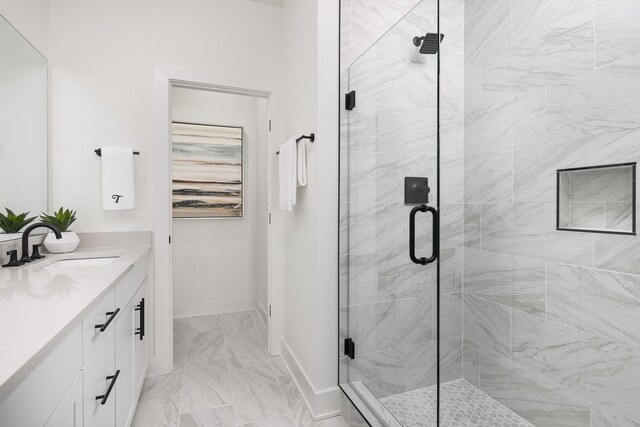 336 Hutcherson Aly, Nashville, TN 37209 - bathroom with vanity, a shower stall, marble look tile flooring, and baseboards