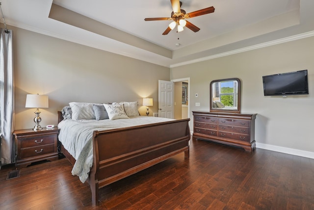 6740 Falls Ridge Ln, College Grove, TN 37046 - bedroom featuring a tray ceiling, hardwood / wood-style floors, baseboards, and crown molding