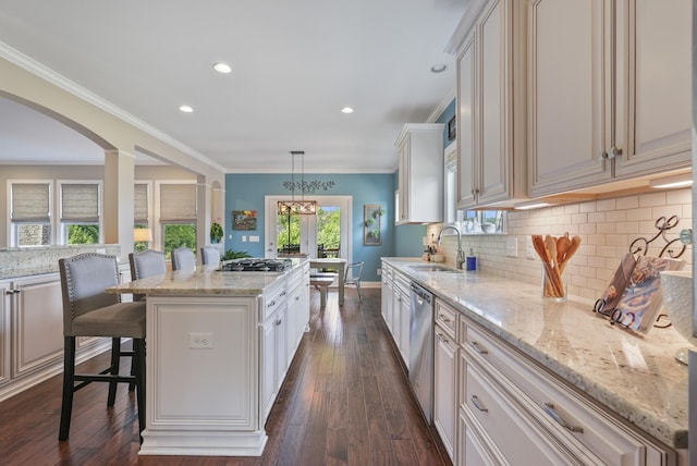 6740 Falls Ridge Ln, College Grove, TN 37046 - kitchen featuring a kitchen island, a sink, appliances with stainless steel finishes, light stone countertops, and recessed lighting