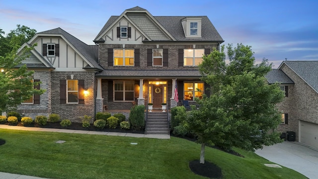 6740 Falls Ridge Ln, College Grove, TN 37046 - craftsman inspired home with a porch, brick siding, driveway, and a lawn