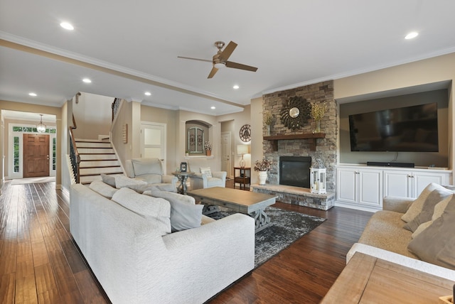 6740 Falls Ridge Ln, College Grove, TN 37046 - living room with ornamental molding, ceiling fan, a fireplace, dark wood finished floors, and stairs