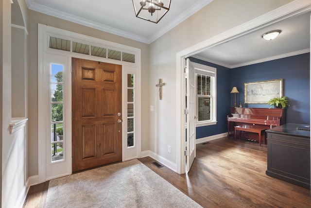 6740 Falls Ridge Ln, College Grove, TN 37046 - entryway with ornamental molding, baseboards, dark wood-style floors, and a chandelier