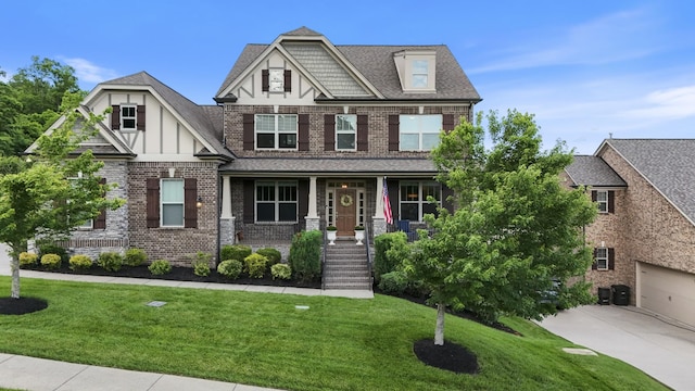 6740 Falls Ridge Ln, College Grove, TN 37046 - craftsman house with a porch, brick siding, a front lawn, and driveway
