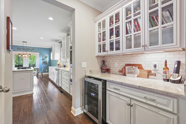 6740 Falls Ridge Ln, College Grove, TN 37046 - bar with beverage cooler, crown molding, a sink, appliances with stainless steel finishes, and dark wood finished floors