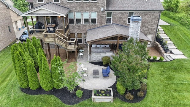 6740 Falls Ridge Ln, College Grove, TN 37046 - back of house featuring stairway, a patio area, brick siding, and a yard