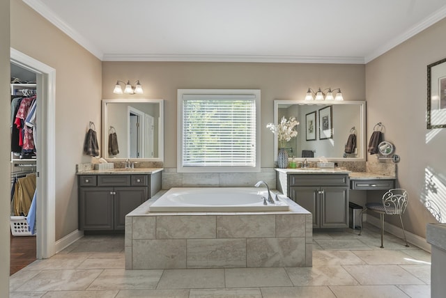6740 Falls Ridge Ln, College Grove, TN 37046 - full bathroom featuring ornamental molding, a bath, two vanities, and a walk in closet