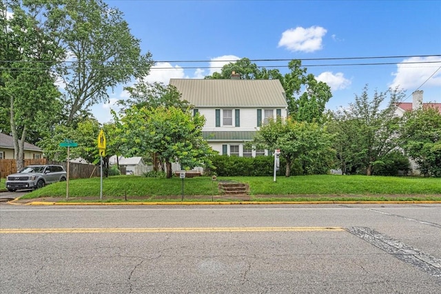 412 Cumberland St E, Cowan, TN 37318 - view of front of house with a front yard and a metal roof