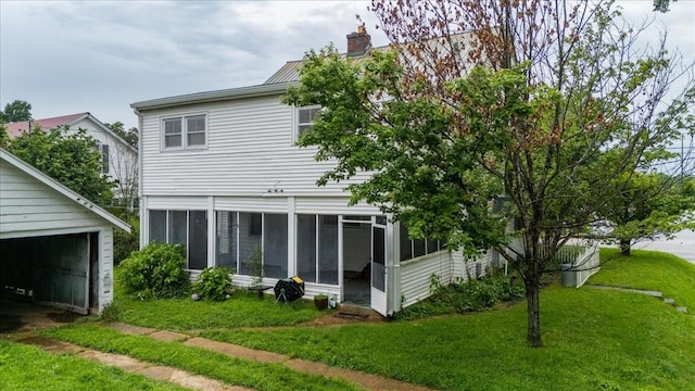 412 Cumberland St E, Cowan, TN 37318 - back of property featuring a sunroom, a yard, and a chimney