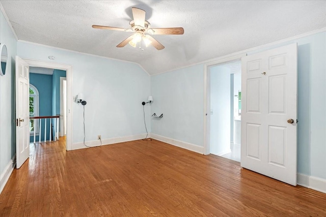 412 Cumberland St E, Cowan, TN 37318 - spare room featuring wood finished floors, ceiling fan, a textured ceiling, and vaulted ceiling