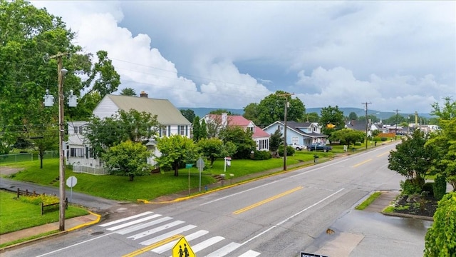 412 Cumberland St E, Cowan, TN 37318 - view of asphalt road featuring sidewalks, traffic signs, and curbs