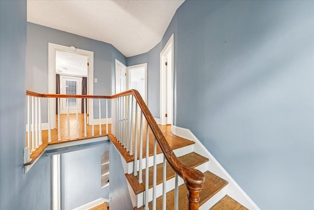 412 Cumberland St E, Cowan, TN 37318 - stairway with baseboards and wood finished floors