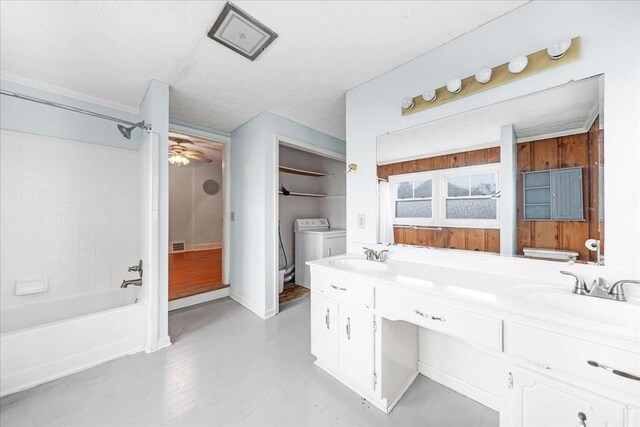 412 Cumberland St E, Cowan, TN 37318 - full bath featuring separate washer and dryer, double vanity, shower / bathtub combination, and a ceiling fan