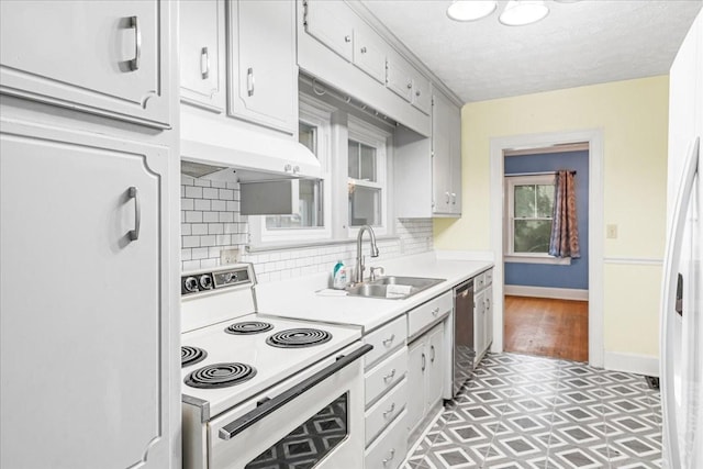 412 Cumberland St E, Cowan, TN 37318 - kitchen with white appliances, light countertops, tasteful backsplash, premium range hood, and a textured ceiling